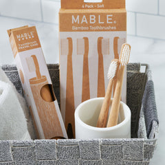 Close-up of the smooth bamboo handle of the MABLE toothbrush