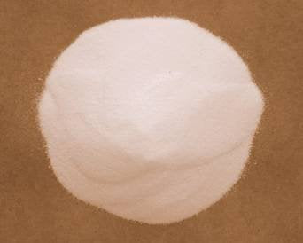 Close-up of very fine MnSO4·H2O powder in a 5 lb bag