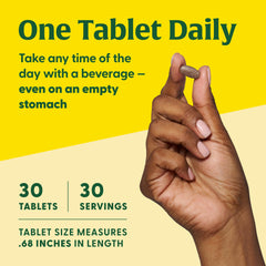 Person taking Blood Builder tablet with water