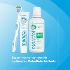Tongue cleaner shown with toothpaste for scale