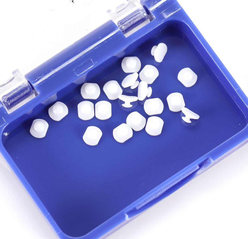 Mesh base lingual button designed for easy bonding