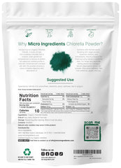 Scooped chlorella powder with a measuring spoon