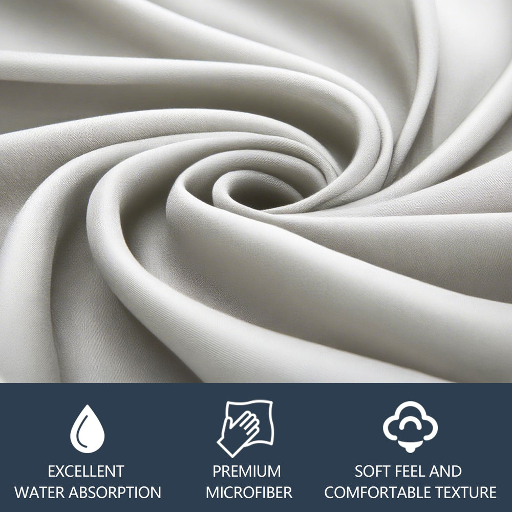 Microfiber cloth cleaning a camera lens