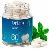 Mint toothpaste tablets in a travel-size jar