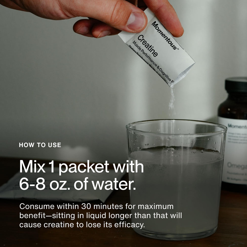 Powder being mixed with Momentous Creatine Monohydrate