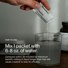 Powder being mixed with Momentous Creatine Monohydrate