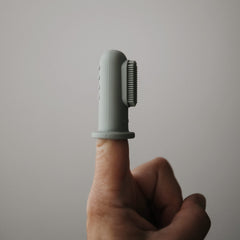 Close-up of soft, food-grade silicone tip on mushie finger toothbrush