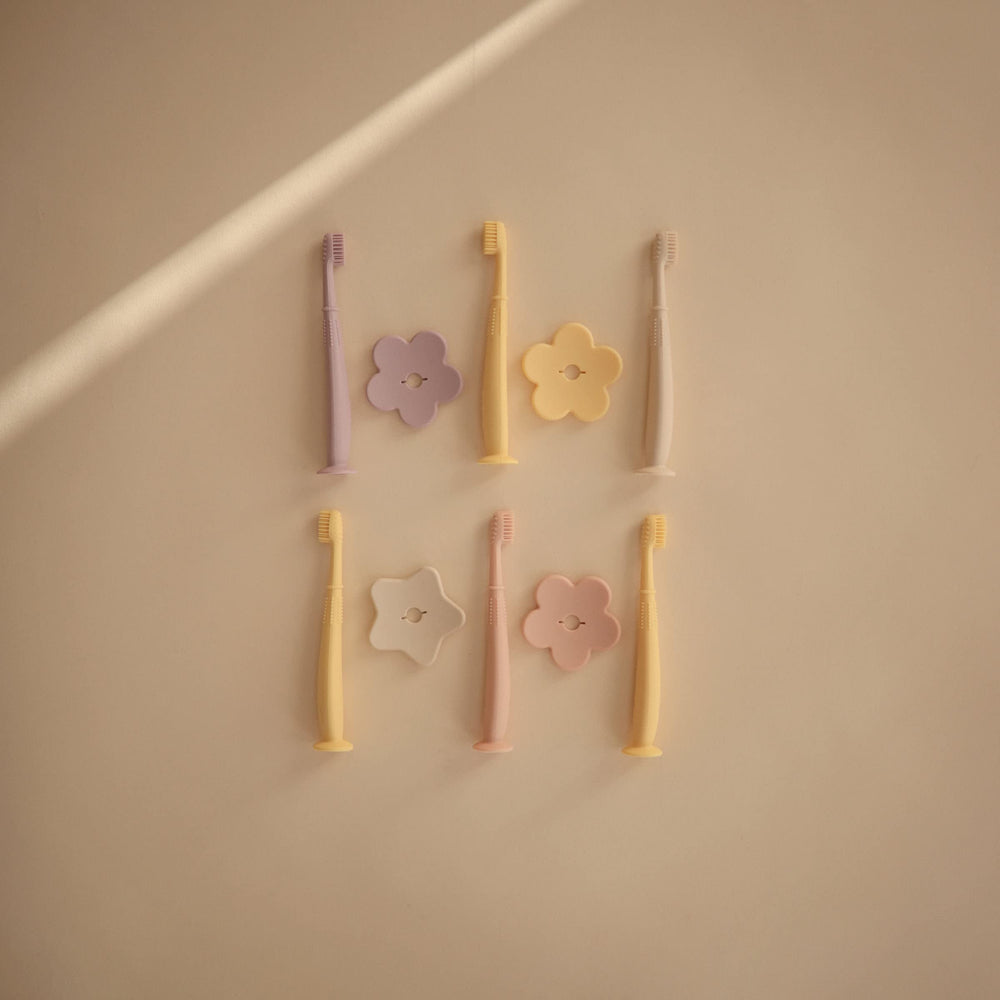Removable safety guard on Mushie Flower Toddler Training Toothbrush Soft Lilac