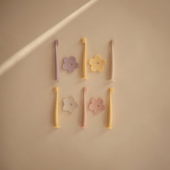 Removable safety guard on Mushie Flower Toddler Training Toothbrush Soft Lilac