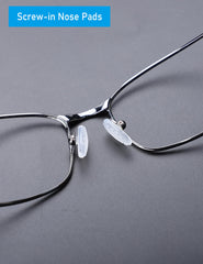 Nose pads being installed into eyeglasses frame with screwdriver
