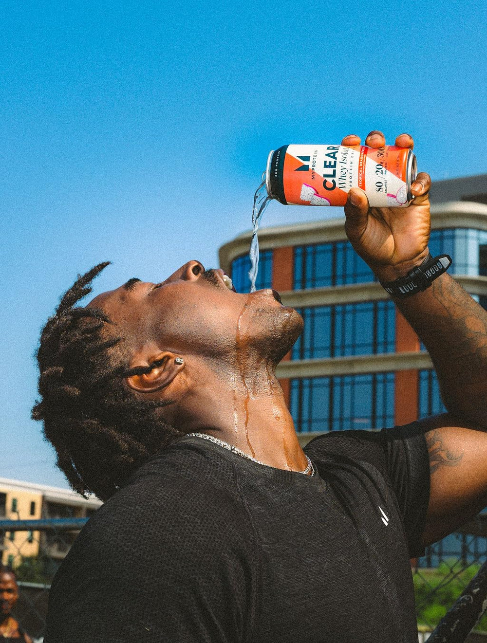 Myprotein Clear Whey Isolate Lemonade ready-to-drink on-the-go usage image.