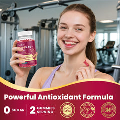 Fresh strawberry slice beside NAD Gummies bottle