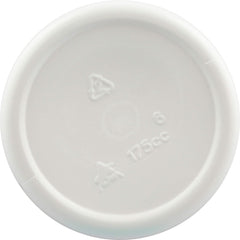 Capsules and bottle on white background