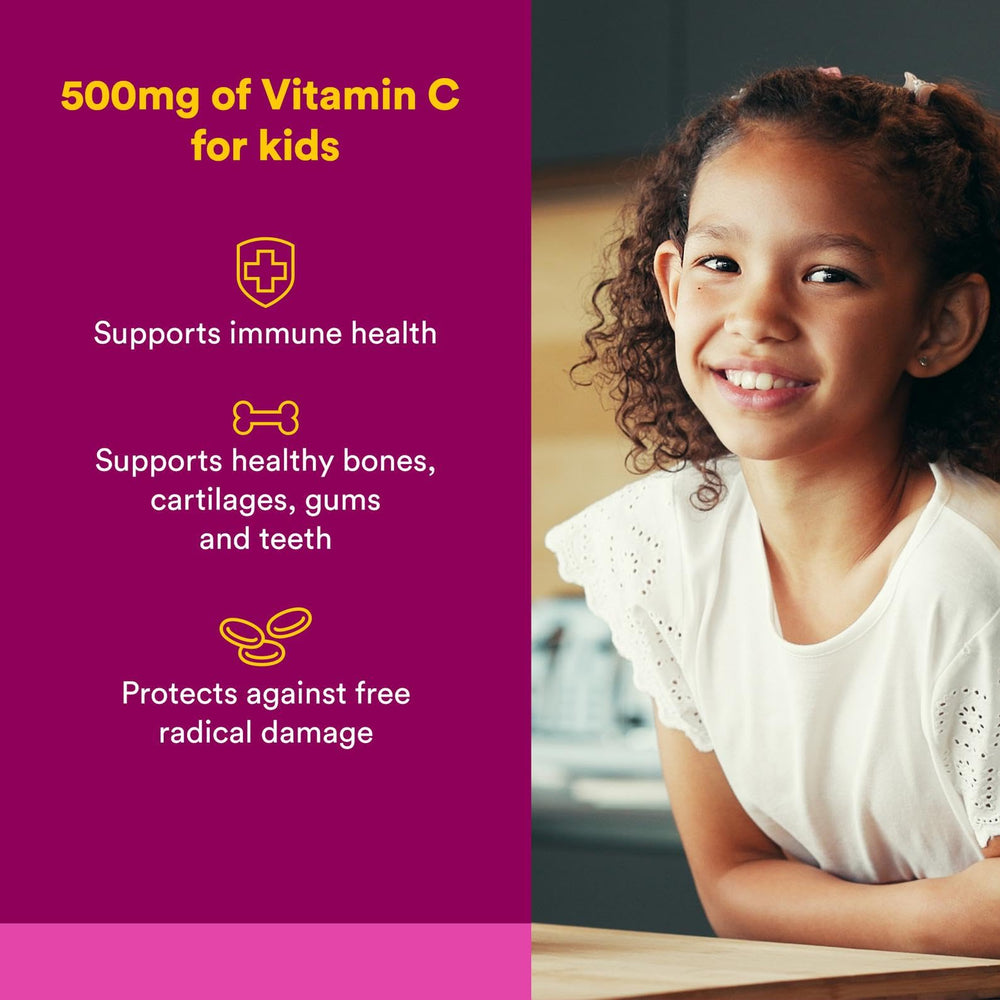 Kids holding a chewable Vitamin C 500 mg wafer