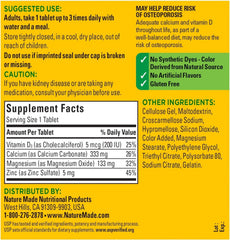 Nature Made calcium magnesium zinc tablets on white background