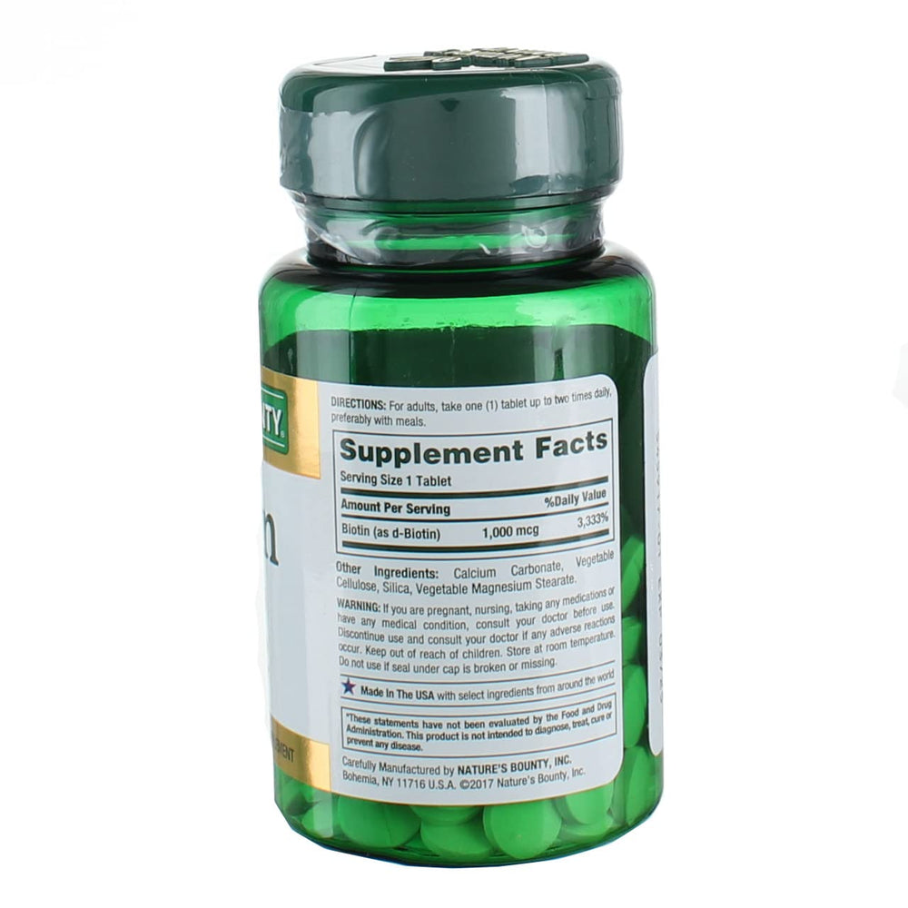 Side view of bottle with cap and packaging