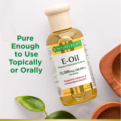 Applying Vitamin E Oil to skin for moisture and radiance