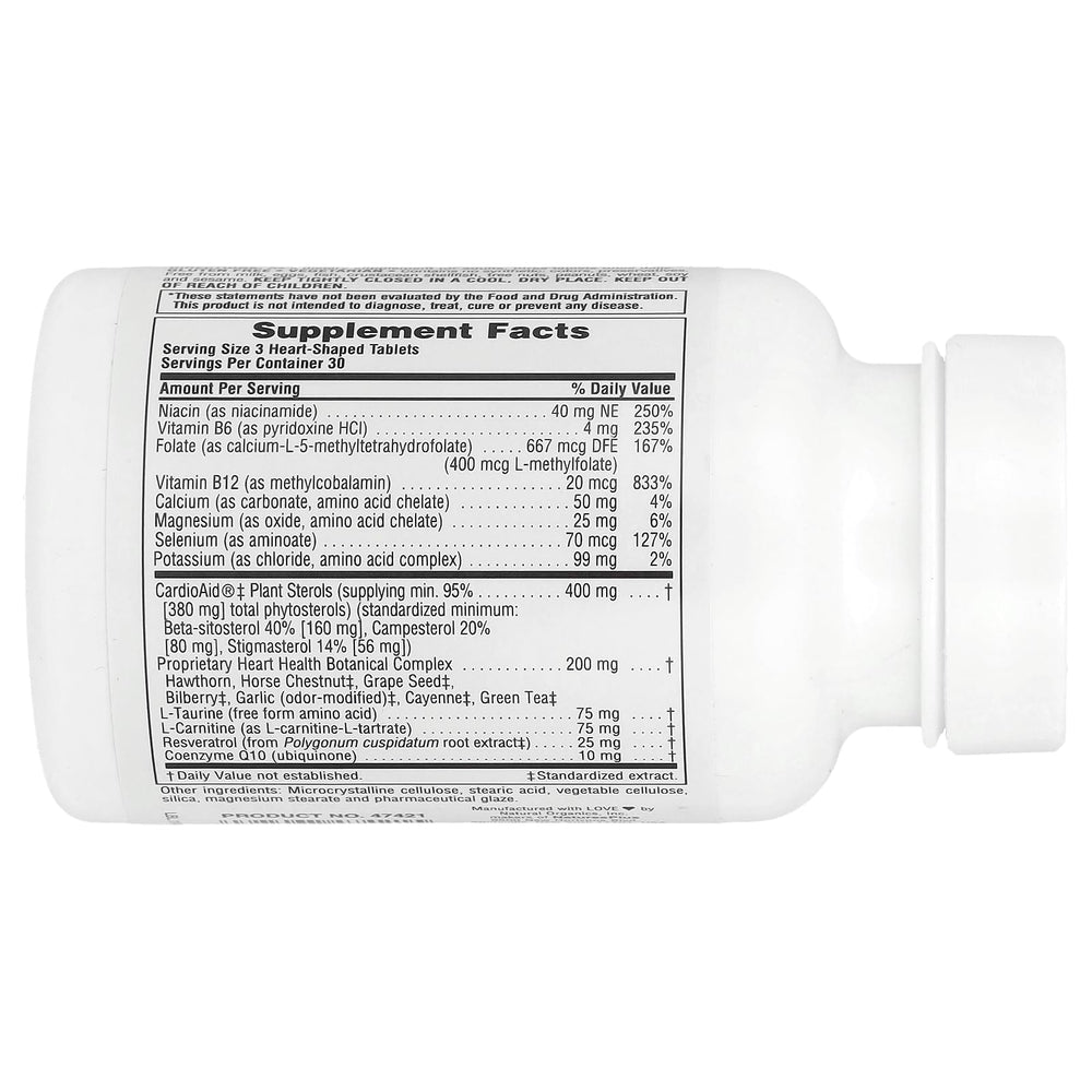 NaturesPlus Heartbeat vegan tablets close-up showing easy-to-swallow form.