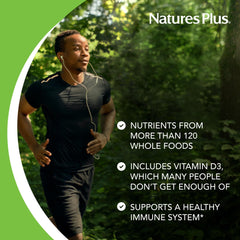 Glass of water with NaturesPlus Source of Life Gold drink mix being poured.