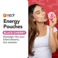 Individual Nectr Energy Black Cherry pouch held in mouth for fast intake