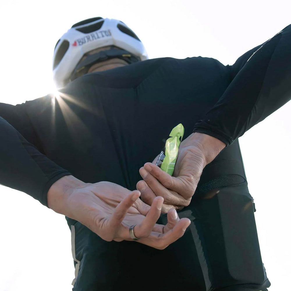 Athlete in action with NeverSecond gel on a long run.