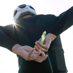 Athlete in action with NeverSecond gel on a long run.