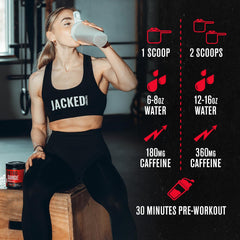 Athlete holding a measured scoop of Nitrosurge Shred