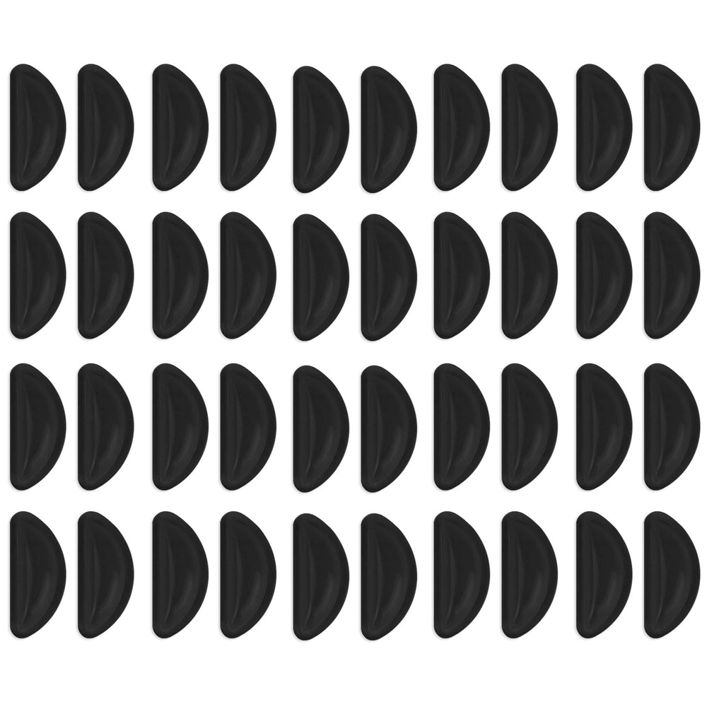 Close-up of black adhesive silicone eyeglass nose pad