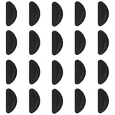 Close-up of black adhesive eyeglass nose pads on glasses