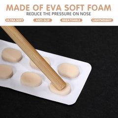 Soft foam self-adhesive eyeglass nose pads close-up