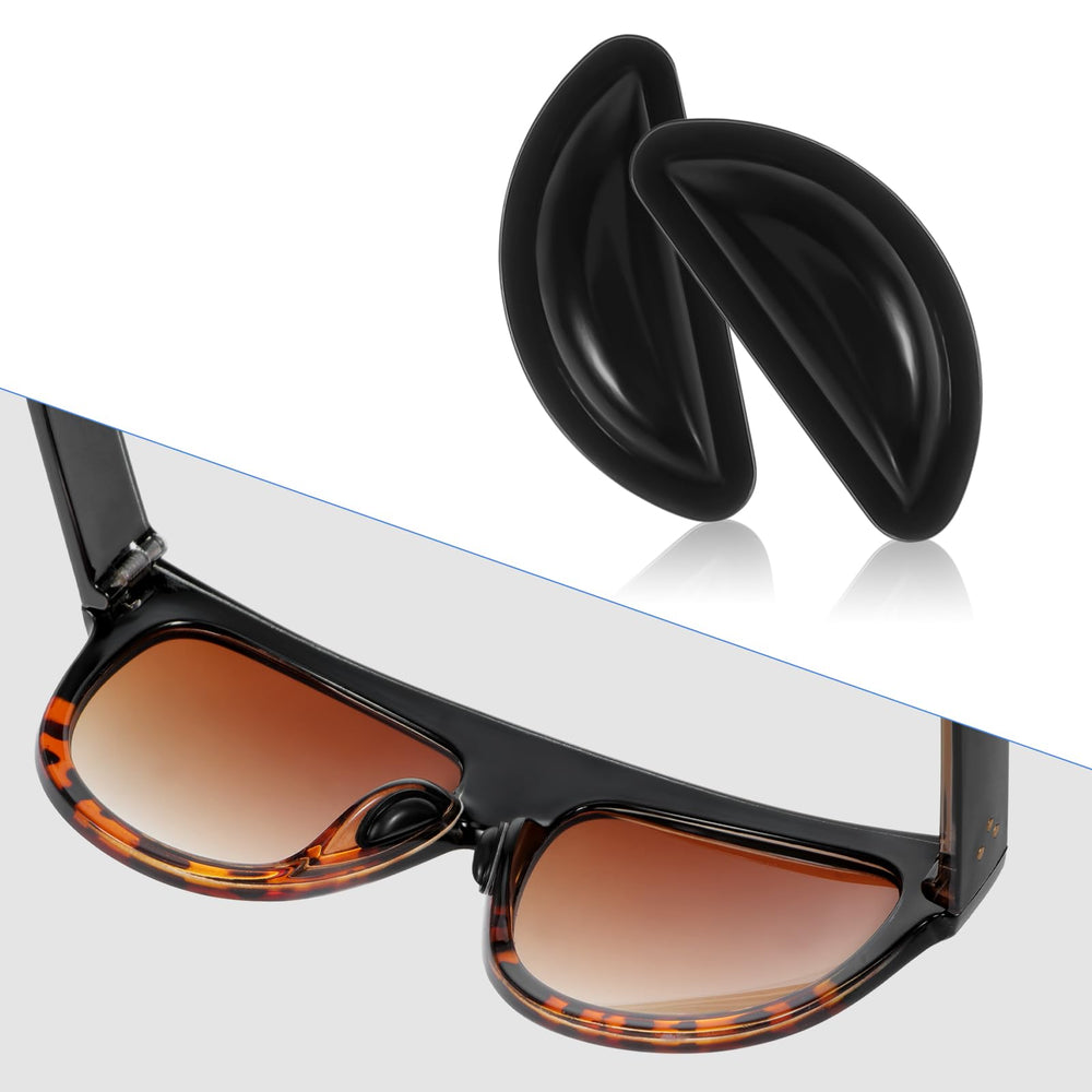 Glasses frame with replacement nose pads