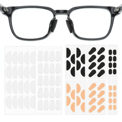 Assorted colors of eyeglass nose pads including skin, black, and transparent