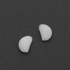 Close-up of soft white silicone nose pads for eyeglasses