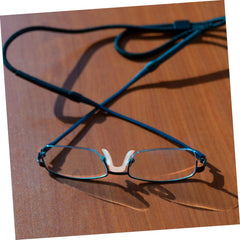 Nose pad attached to eyeglasses nose bridge
