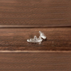 Eyeglasses with replacement nose pads suitable for screw-in mounts