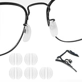 Close-up of white silicone anti-slip nose pads for rimless glasses