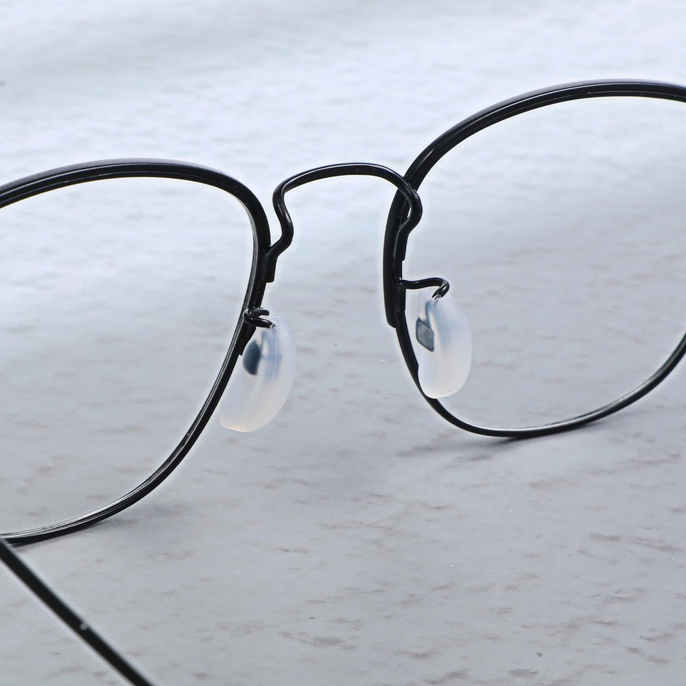 Package showing 10 pairs of white silicone nose pads