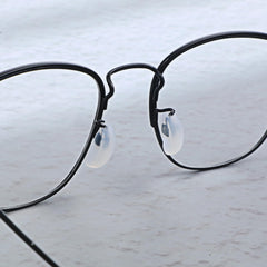 Package showing 10 pairs of white silicone nose pads