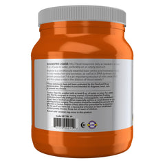 Scoop of white L-Arginine powder next to jar