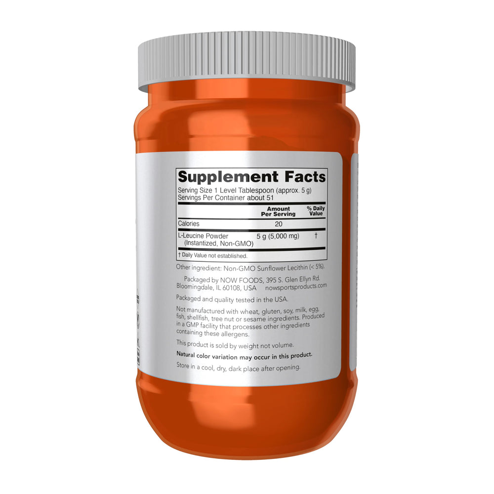 NOW Foods Leucine powder label close-up shows vegan formula and GMP quality.