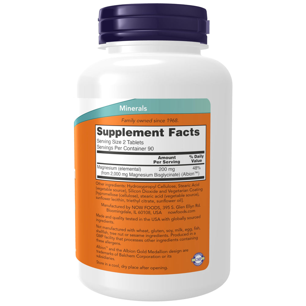 NOW Foods Magnesium Glycinate 100 mg tablets close-up show smooth, even pills.