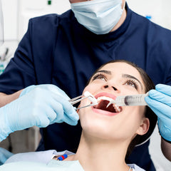 Curved irrigator syringe designed to reach hard to access areas