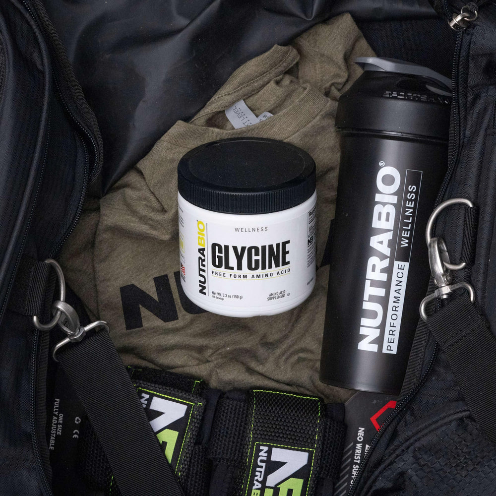 NutraBio glycine powder flat lay with container and scoop