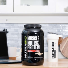 NutraBio Muscle Matrix scoop and jar, convenient serving tool for fast and slow protein release.