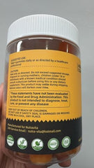 Close-up of orange-flavored EAA Gummies texture