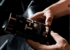 Nutrex Research T-UP bottle on shelf; premium performance supplement for active lifestyles.