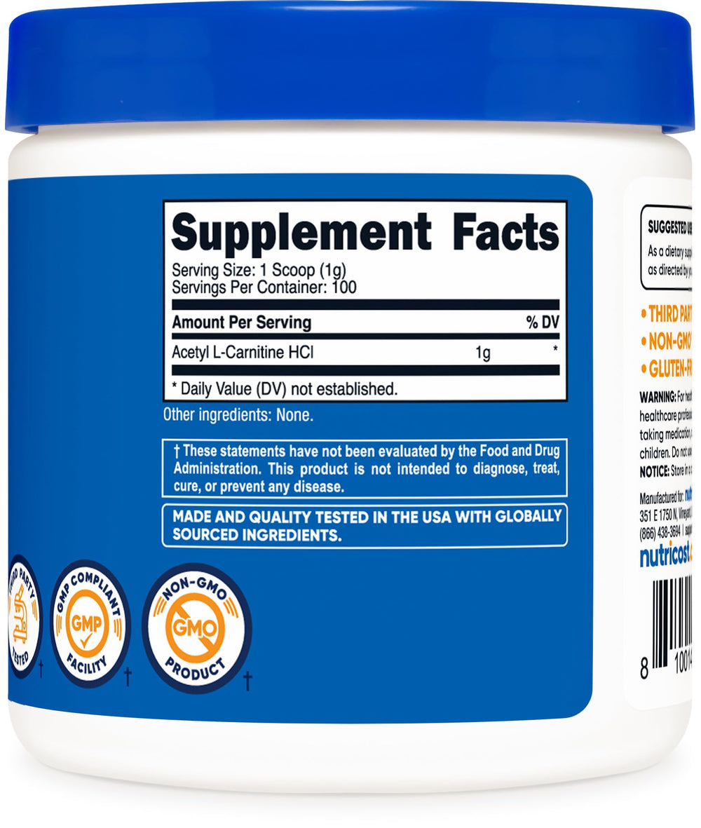 Powder in scoop beside container