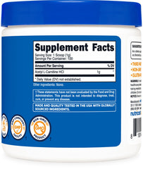 Powder in scoop beside container