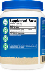 Cinnamon powder being sprinkled into a recipe in a kitchen