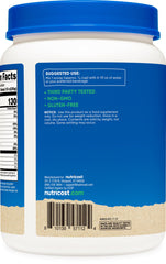 Nutricost Organic Whey Protein Concentrate scoop beside powder showing convenient 1 lb packaging